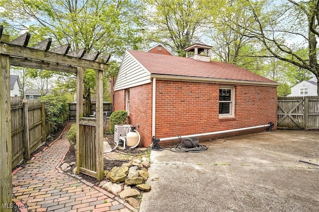 7219 N Lima Rd, Poland, OH 44514 - view of side of property with brick siding and a pergola