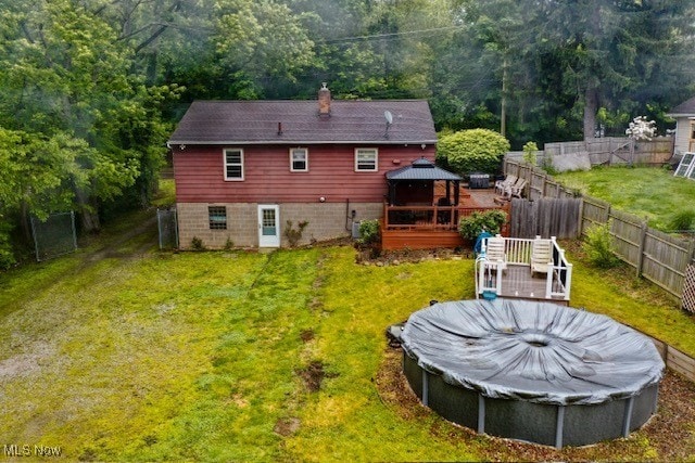 3364 Cormany Rd, Akron, OH 44319 - rear view of property with a gazebo, a chimney, a fenced backyard, and a deck