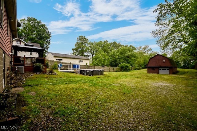 3364 Cormany Rd, Akron, OH 44319 - view of green lawn with an outdoor structure and a wooden deck