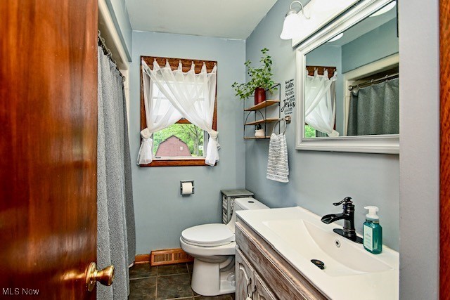 3364 Cormany Rd, Akron, OH 44319 - full bath with vanity, tile patterned flooring, and a shower with shower curtain