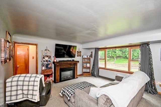 3364 Cormany Rd, Akron, OH 44319 - carpeted living area featuring a glass covered fireplace and baseboards