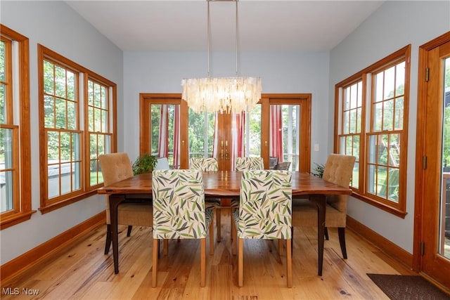 121 Sycamore Pl, Oberlin, OH 44074 - dining room featuring a chandelier and light wood finished floors