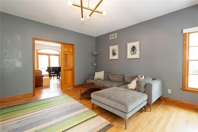 121 Sycamore Pl, Oberlin, OH 44074 - living room with light wood-type flooring and a chandelier