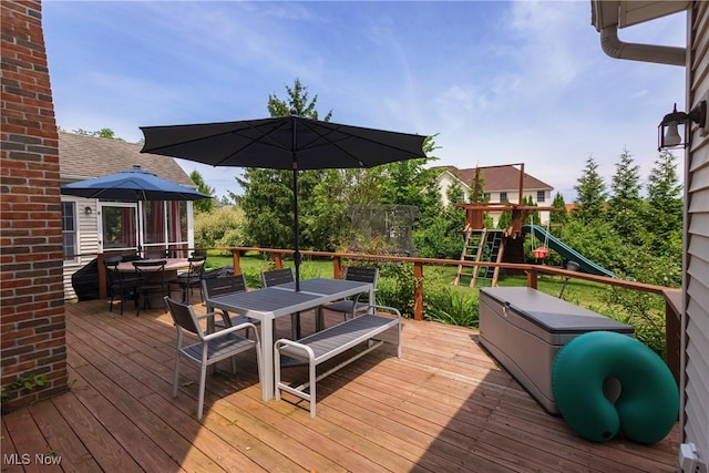 121 Sycamore Pl, Oberlin, OH 44074 - deck featuring outdoor dining area and a playground
