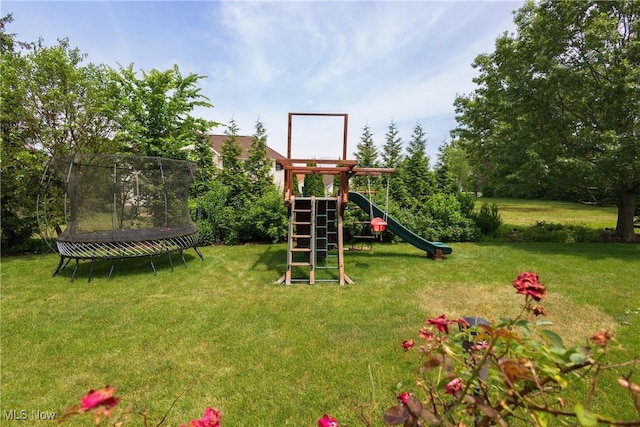 121 Sycamore Pl, Oberlin, OH 44074 - view of play area featuring a trampoline and a lawn