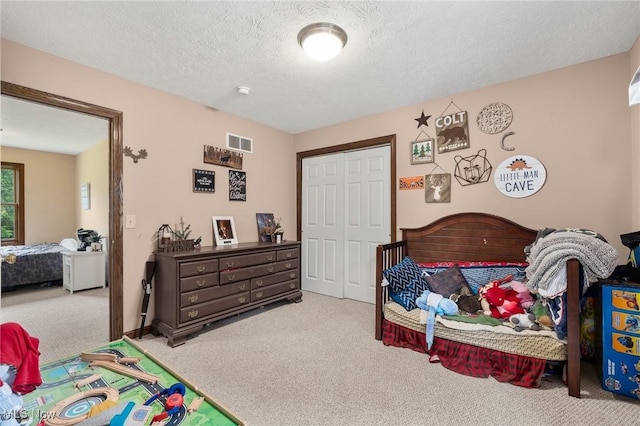 1345 County Road 16, New London, OH 44851 - bedroom with carpet floors, a closet, and a textured ceiling