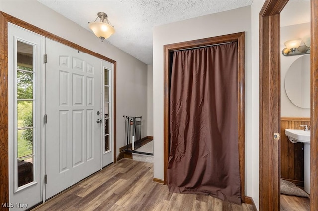 1345 County Road 16, New London, OH 44851 - entrance foyer with wood finished floors and a textured ceiling