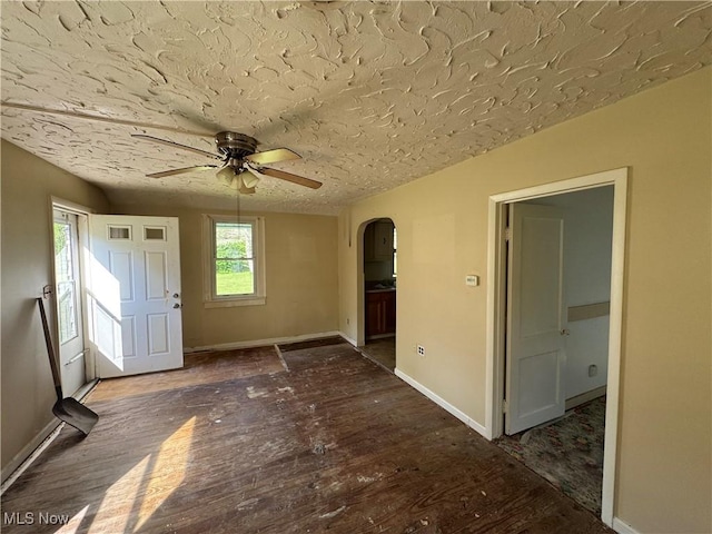 7138 Jefferson Rd, Ashtabula, OH 44004 - entrance foyer featuring arched walkways, a ceiling fan, wood finished floors, and a textured ceiling