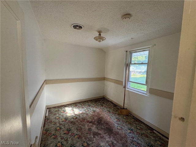 7138 Jefferson Rd, Ashtabula, OH 44004 - empty room featuring a smoke detector, a textured ceiling, and carpet floors