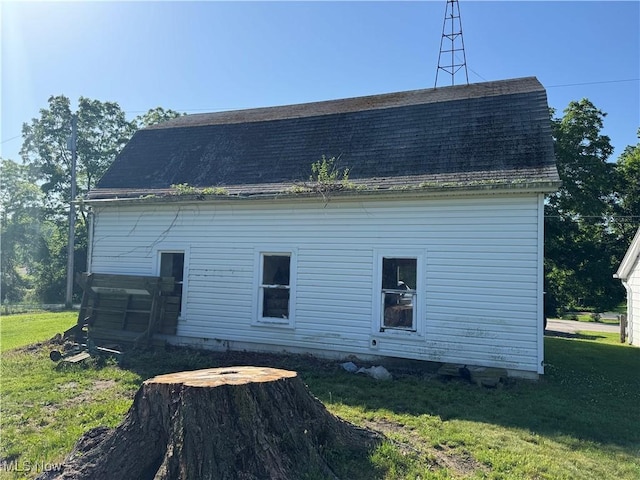 7138 Jefferson Rd, Ashtabula, OH 44004 - view of property exterior with a lawn and roof with shingles
