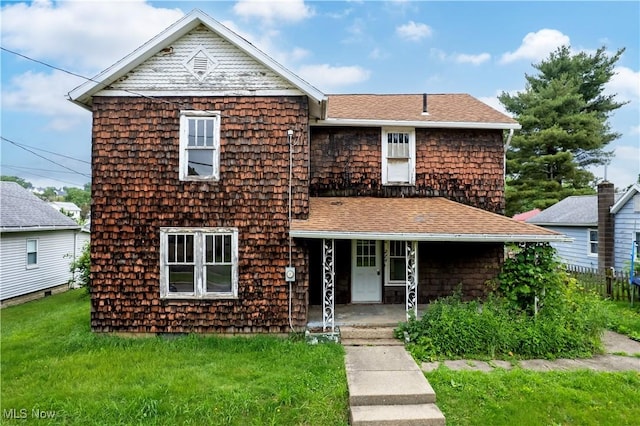 274 E S St, Shreve, OH 44676 - view of front of home with a porch, a front lawn, and a shingled roof
