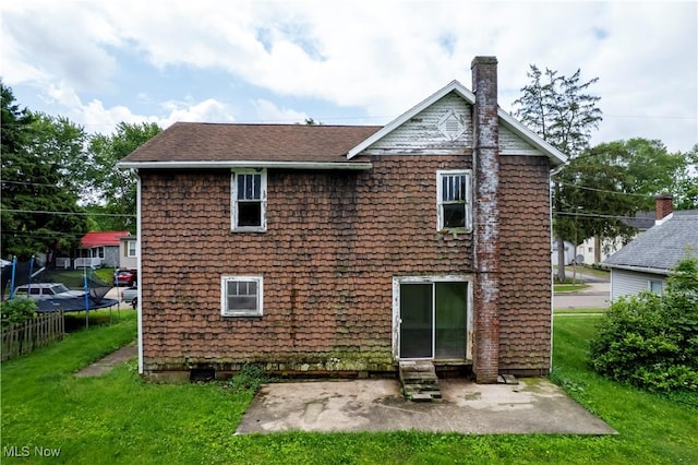 274 E S St, Shreve, OH 44676 - rear view of house with a chimney, a patio area, a yard, and entry steps