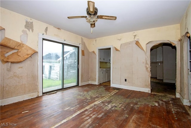 274 E S St, Shreve, OH 44676 - unfurnished room with wood-type flooring, ceiling fan, and arched walkways