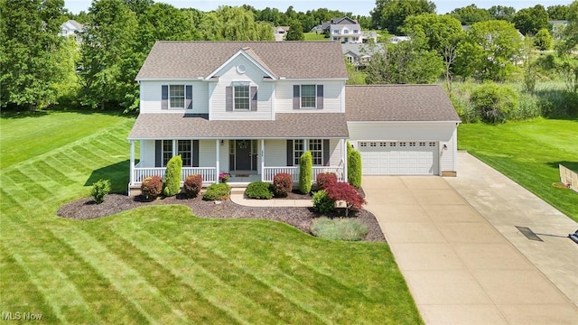 4670 King Meadow Trl, Kent, OH 44240 - view of front of property with covered porch, driveway, a garage, and a front yard