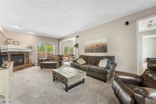 4670 King Meadow Trl, Kent, OH 44240 - carpeted living area featuring a textured ceiling and a stone fireplace