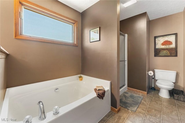4670 King Meadow Trl, Kent, OH 44240 - bathroom featuring a garden tub, a shower stall, and a textured ceiling
