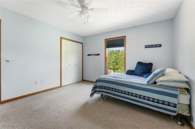 4670 King Meadow Trl, Kent, OH 44240 - carpeted bedroom featuring a textured ceiling, a closet, and a ceiling fan