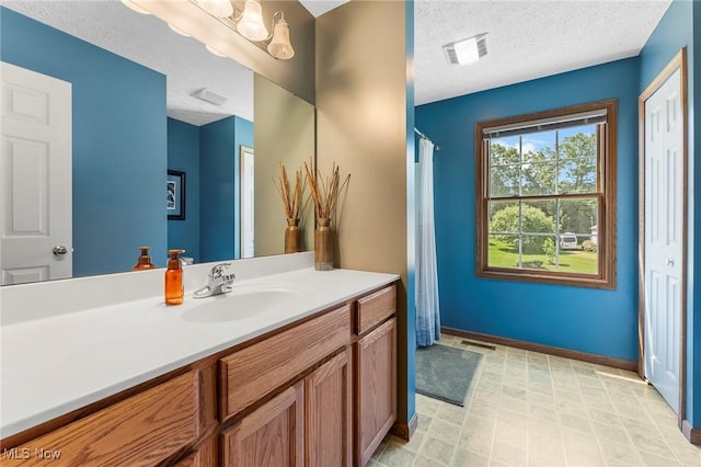 4670 King Meadow Trl, Kent, OH 44240 - full bathroom featuring vanity, a textured ceiling, and curtained shower