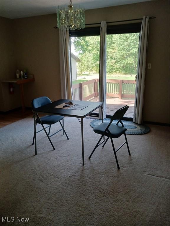 14172 Hametown Rd, Doylestown, OH 44230 - dining area with a chandelier and carpet
