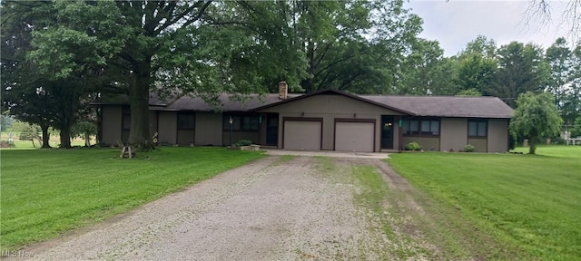 14172 Hametown Rd, Doylestown, OH 44230 - ranch-style house featuring driveway, an attached garage, and a front yard