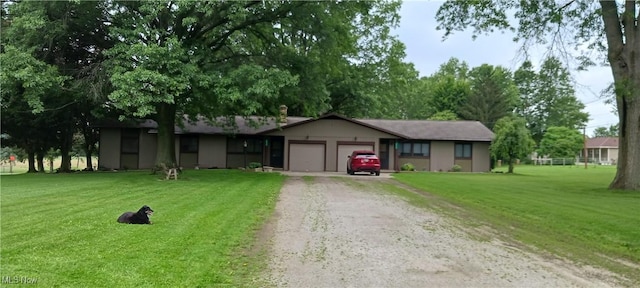 14172 Hametown Rd, Doylestown, OH 44230 - single story home with driveway, an attached garage, and a front yard