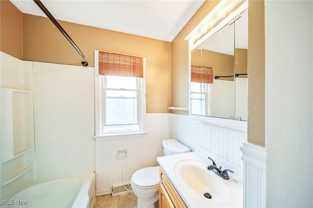 6306 Gilbert Ave, Parma, OH 44129 - full bath with a wainscoted wall, vanity, shower / bathtub combination, and tile patterned floors