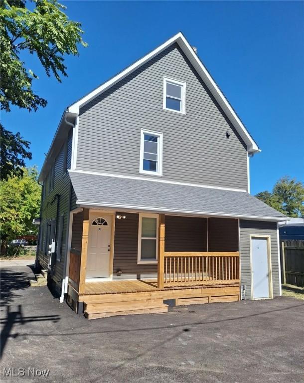 1431 Rowley Ave, Cleveland, OH 44109 - view of front facade featuring covered porch and a shingled roof