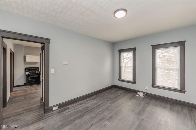 1431 Rowley Ave, Cleveland, OH 44109 - empty room featuring dark wood-style flooring and baseboards