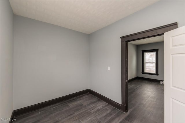 1431 Rowley Ave, Cleveland, OH 44109 - empty room with dark wood-style flooring and baseboards