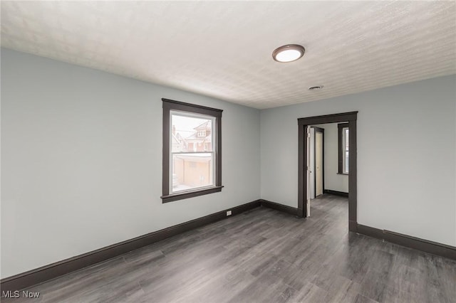1431 Rowley Ave, Cleveland, OH 44109 - spare room with wood finished floors and baseboards
