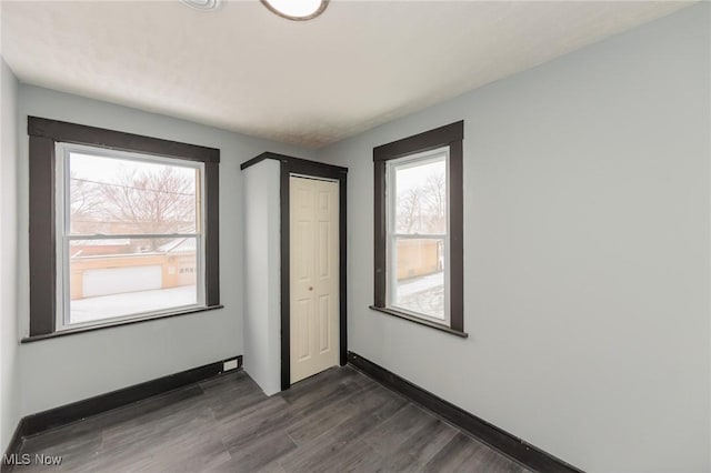 1431 Rowley Ave, Cleveland, OH 44109 - unfurnished bedroom with dark wood-style flooring and a closet