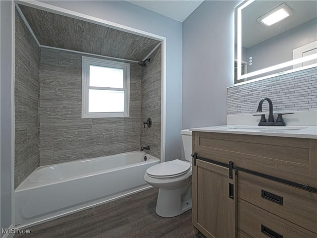 1033 Chalker St, Akron, OH 44310 - bathroom featuring vanity, shower / bath combination, wood finished floors, and decorative backsplash