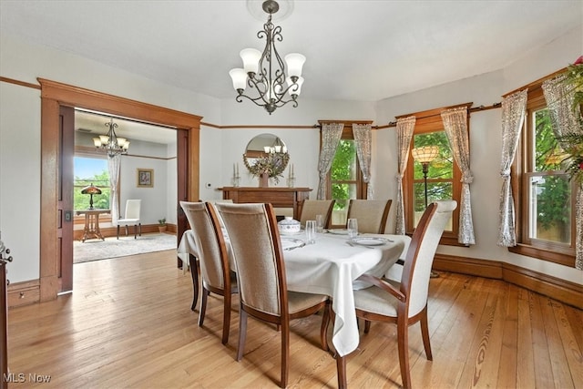 201 E Spring St, Marietta, OH 45750 - dining space with a chandelier, plenty of natural light, and light wood-style flooring