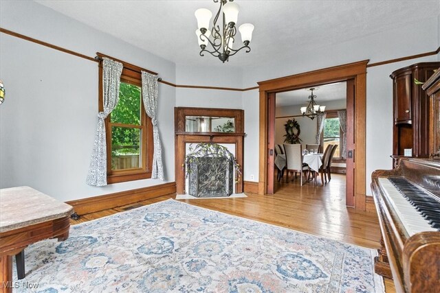 201 E Spring St, Marietta, OH 45750 - foyer featuring a chandelier and wood finished floors