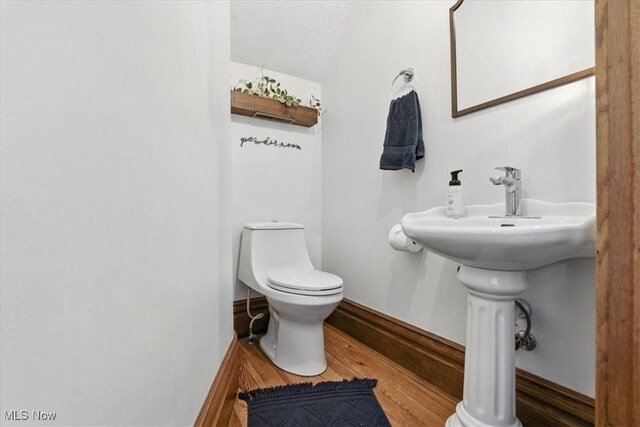 201 E Spring St, Marietta, OH 45750 - bathroom with toilet and wood finished floors