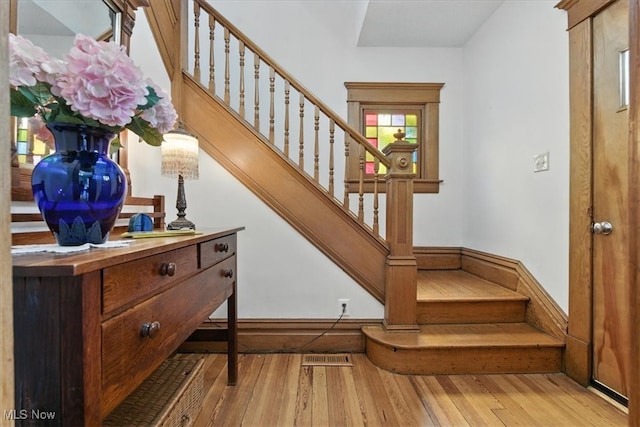 201 E Spring St, Marietta, OH 45750 - staircase featuring hardwood / wood-style floors
