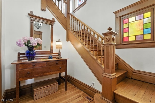 201 E Spring St, Marietta, OH 45750 - staircase featuring wood finished floors and a high ceiling