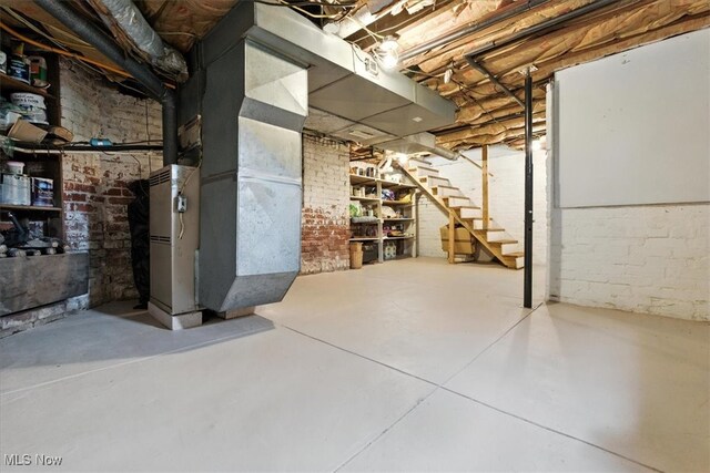201 E Spring St, Marietta, OH 45750 - unfinished basement with stairs and brick wall