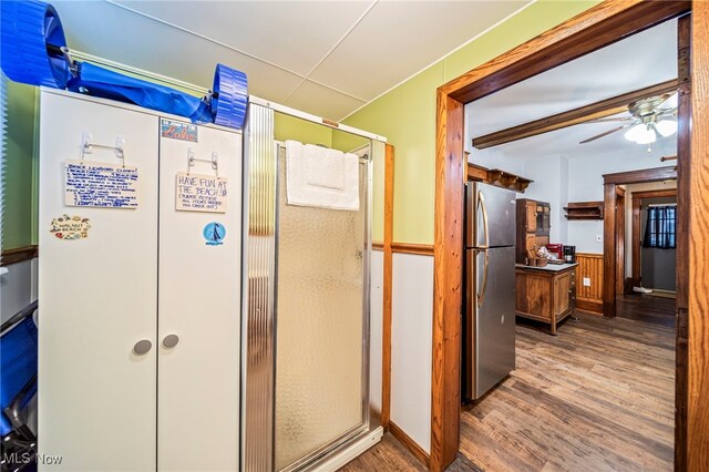 1833 W 7th St, Ashtabula, OH 44004 - bathroom with wood finished floors, a ceiling fan, a stall shower, and vanity