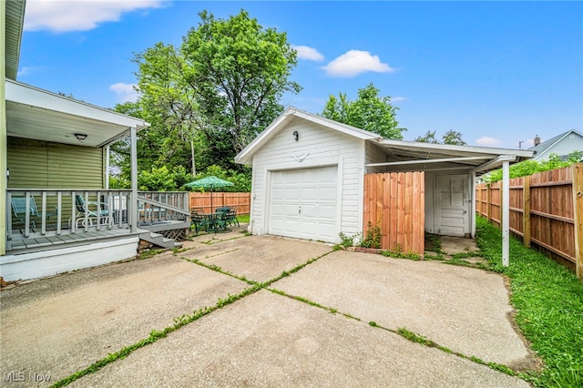 1833 W 7th St, Ashtabula, OH 44004 - garage featuring a garage and concrete driveway