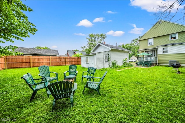 1833 W 7th St, Ashtabula, OH 44004 - view of yard featuring an outdoor structure and a fire pit