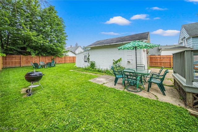 1833 W 7th St, Ashtabula, OH 44004 - fenced backyard featuring an outdoor fire pit and a patio area