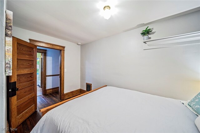 1833 W 7th St, Ashtabula, OH 44004 - bedroom featuring dark wood-type flooring and baseboards