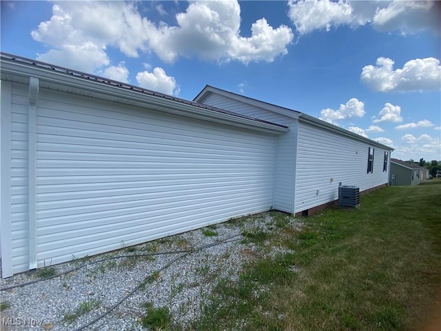 67330 Ebbert Rd Unit 9, Saint Clairsville, OH 43950 - view of property exterior featuring a yard and a central AC unit