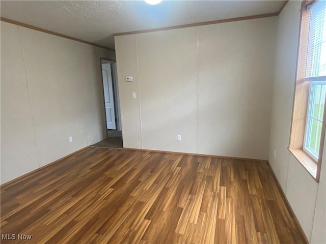 67330 Ebbert Rd Unit 9, Saint Clairsville, OH 43950 - empty room featuring crown molding and wood finished floors