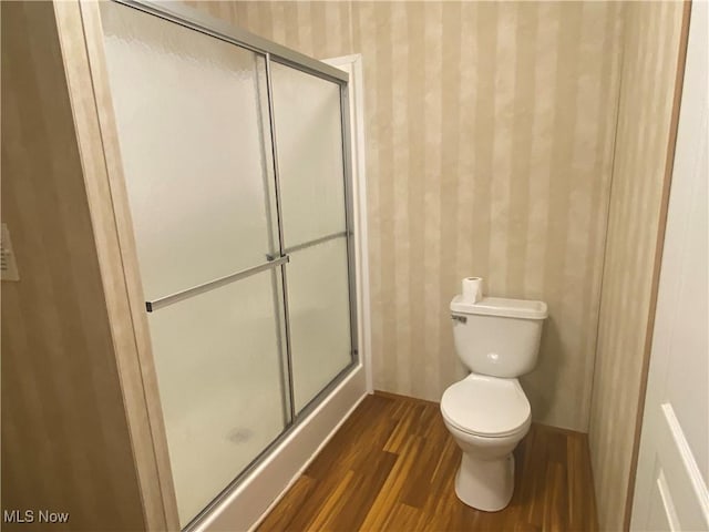 67330 Ebbert Rd Unit 9, Saint Clairsville, OH 43950 - bathroom featuring wallpapered walls, wood finished floors, and a shower stall
