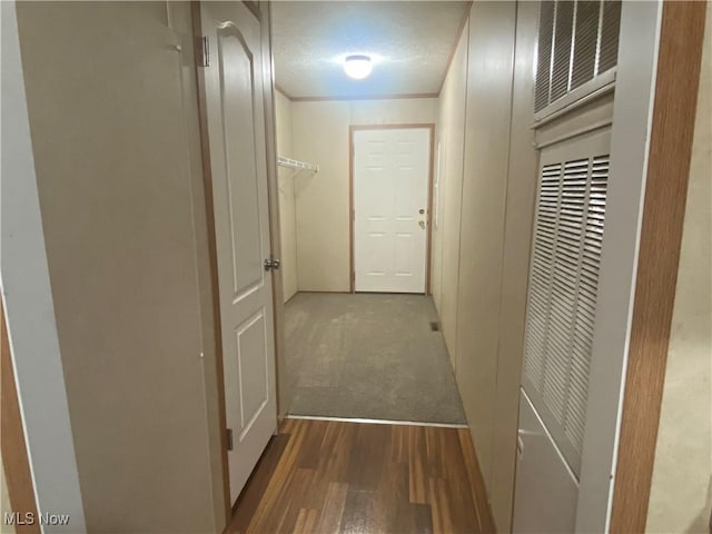 67330 Ebbert Rd Unit 9, Saint Clairsville, OH 43950 - hallway featuring wood finished floors and a textured ceiling