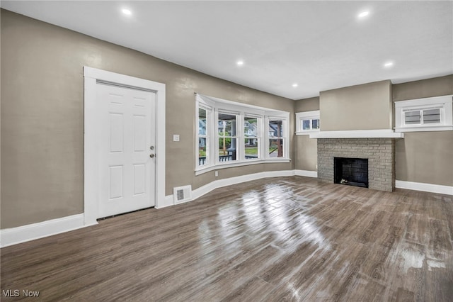 12616 Arlington Ave, Cleveland, OH 44108 - unfurnished living room featuring wood finished floors, recessed lighting, and a fireplace