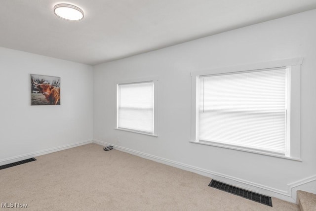 2830 Harmont Ave NE, Canton, OH 44705 - carpeted spare room featuring baseboards