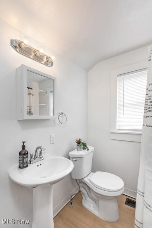 2830 Harmont Ave NE, Canton, OH 44705 - bathroom featuring wood finished floors and curtained shower